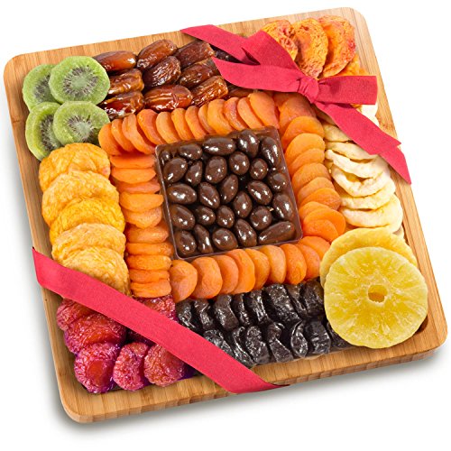 Dried Fruit And Chocolate Nuts On Bamboo Cutting Board Serving Tray